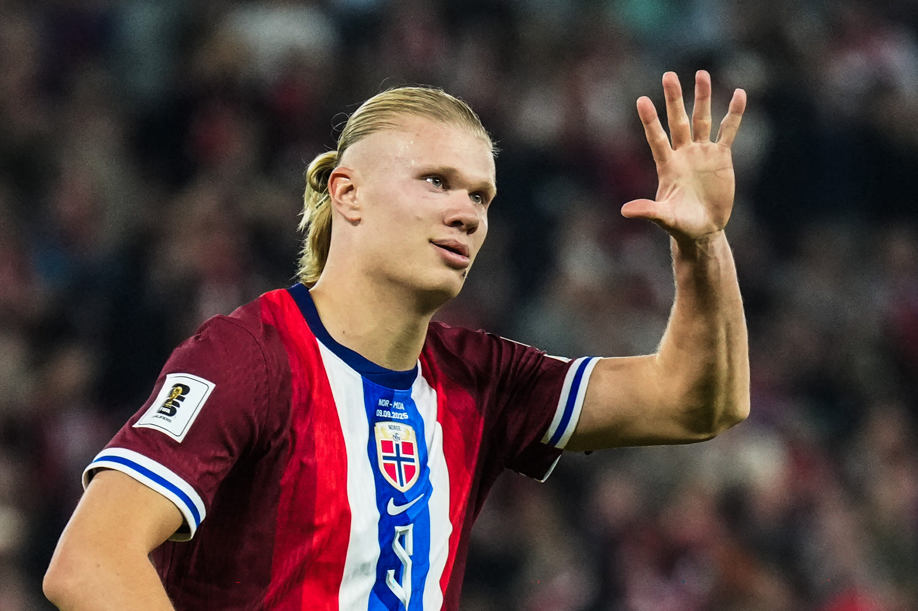 Erling Haaland waves during a World Cup qualifier. 