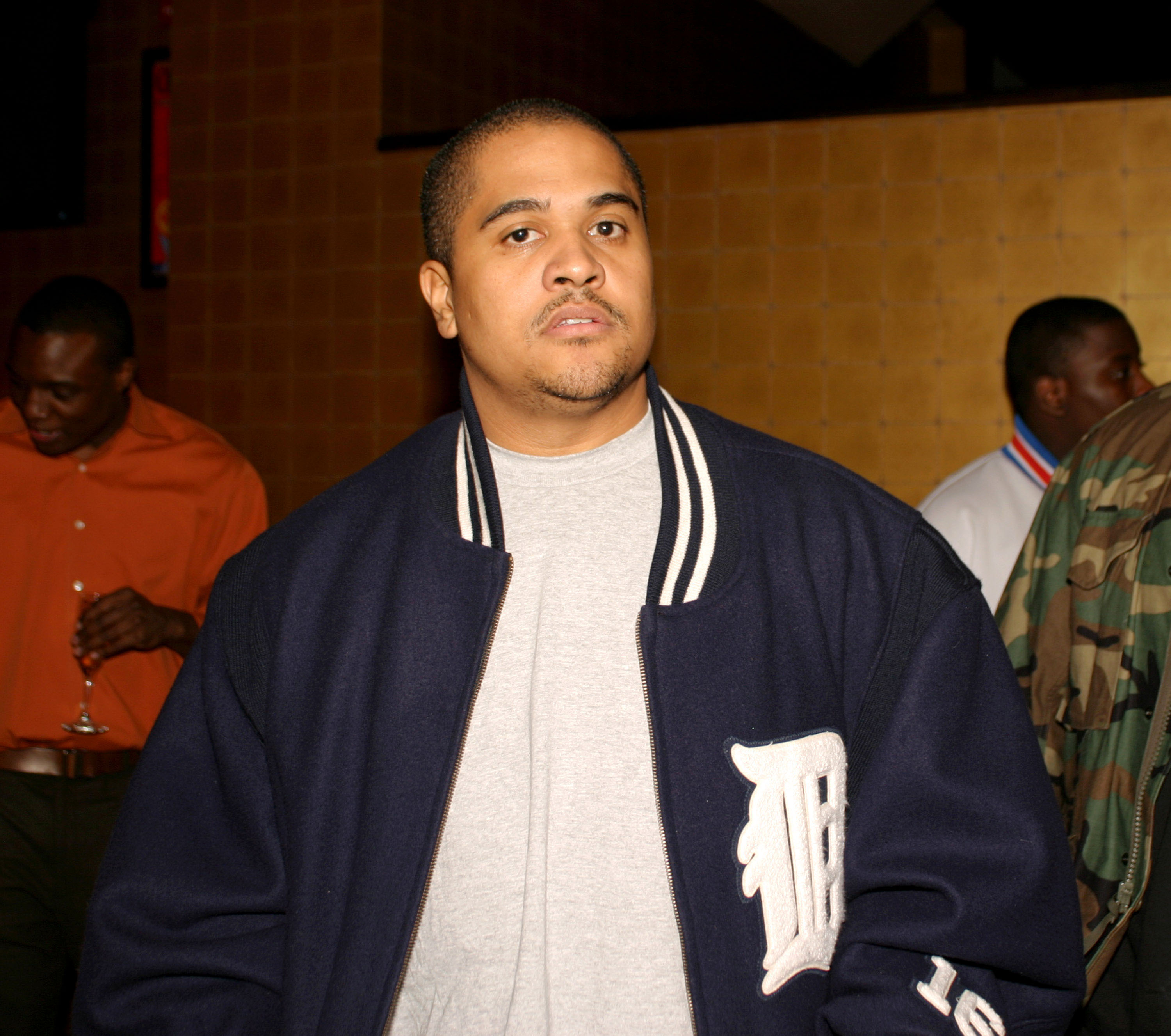 Irv Gotti in a navy jacket with a 