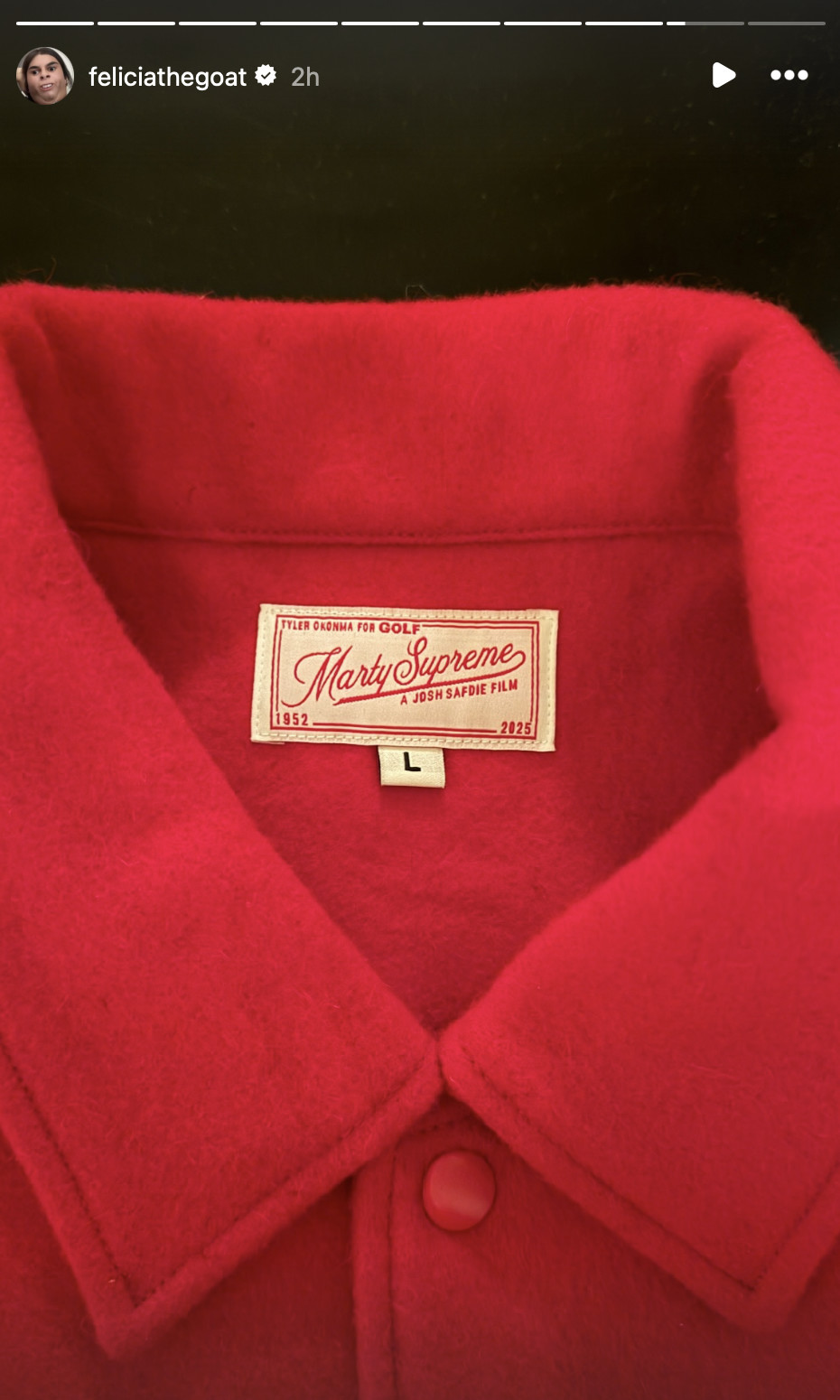 Close-up of a red shirt collar with a label reading 